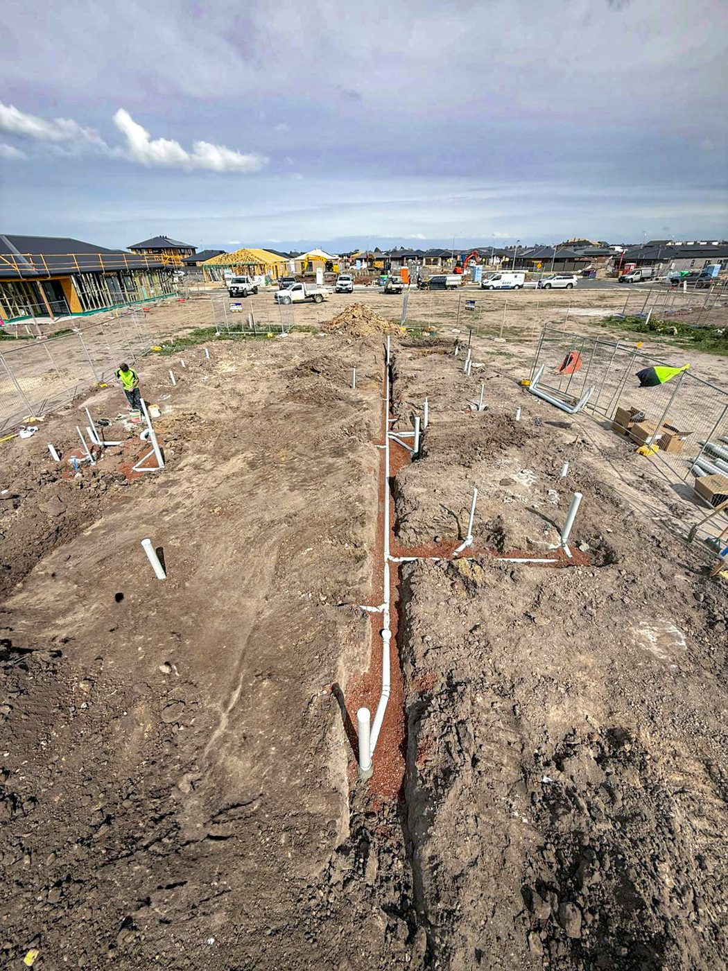 Long drainage trench running across an estate block.