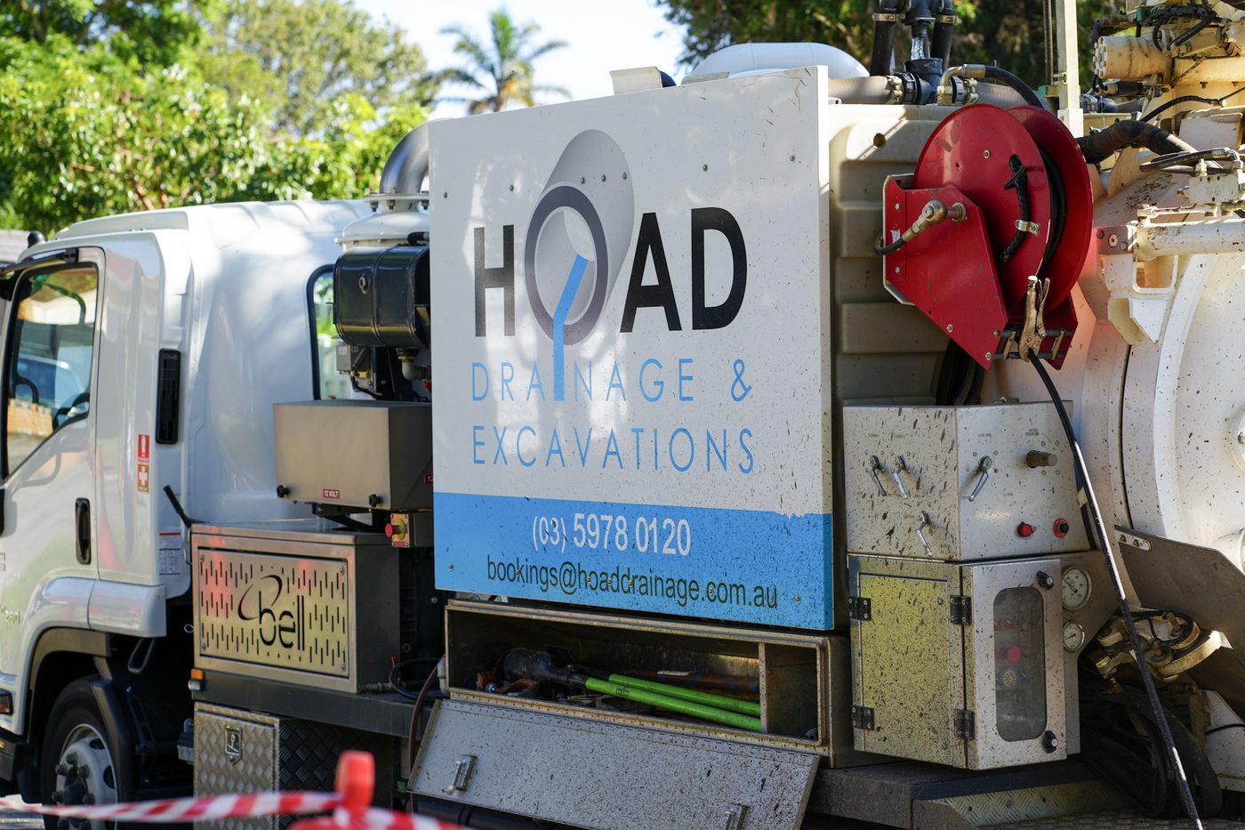 Branded Hoad Drainage service truck loaded with equipment.