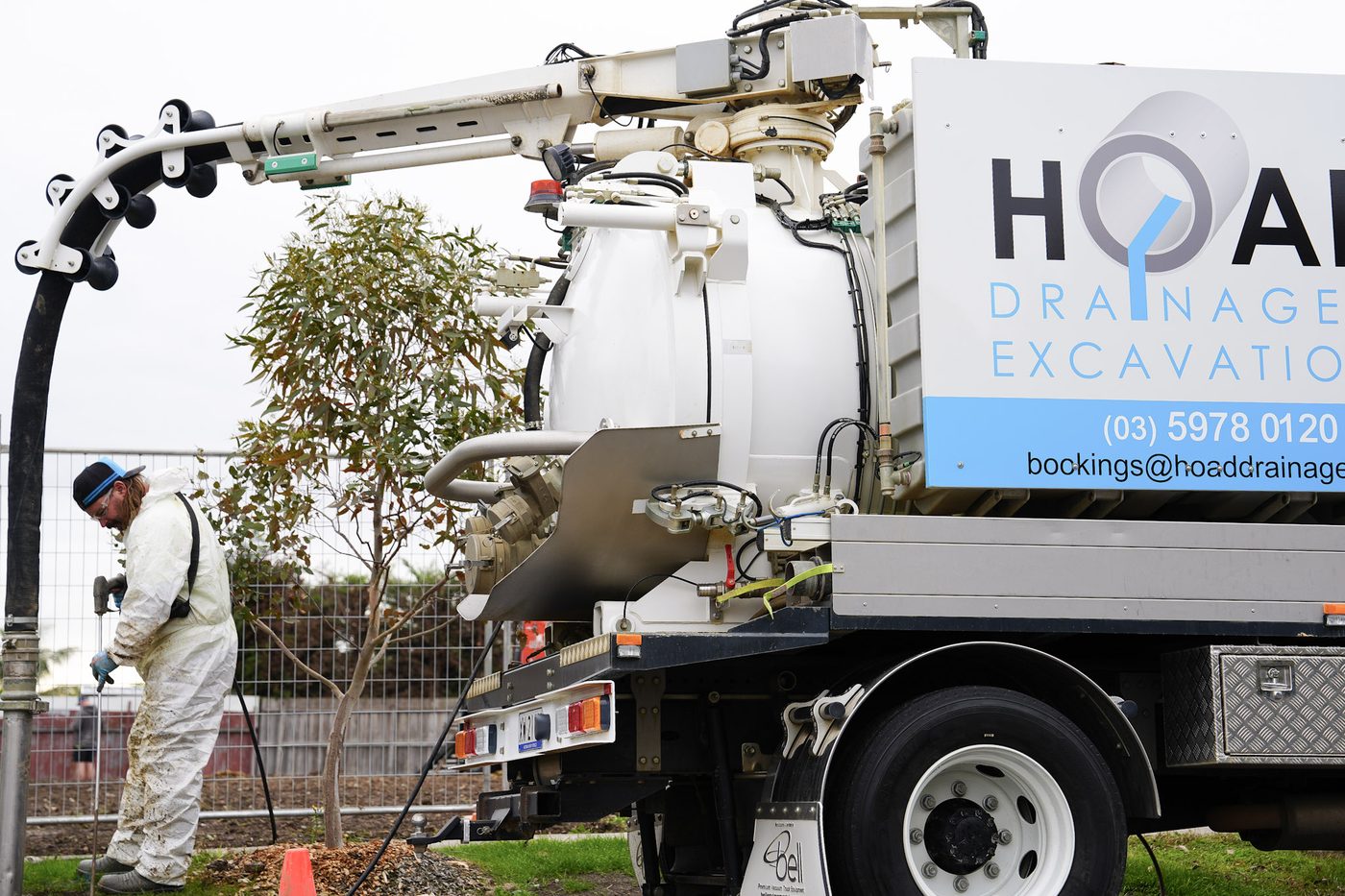 Hoad Drainage vacuum excavation truck and operator on site.