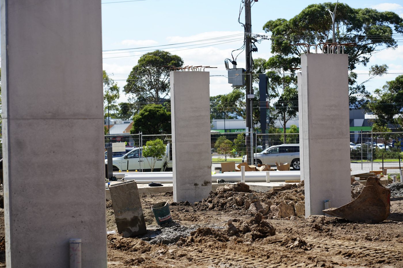 Precast concrete stormwater pits staged on site ready to set.