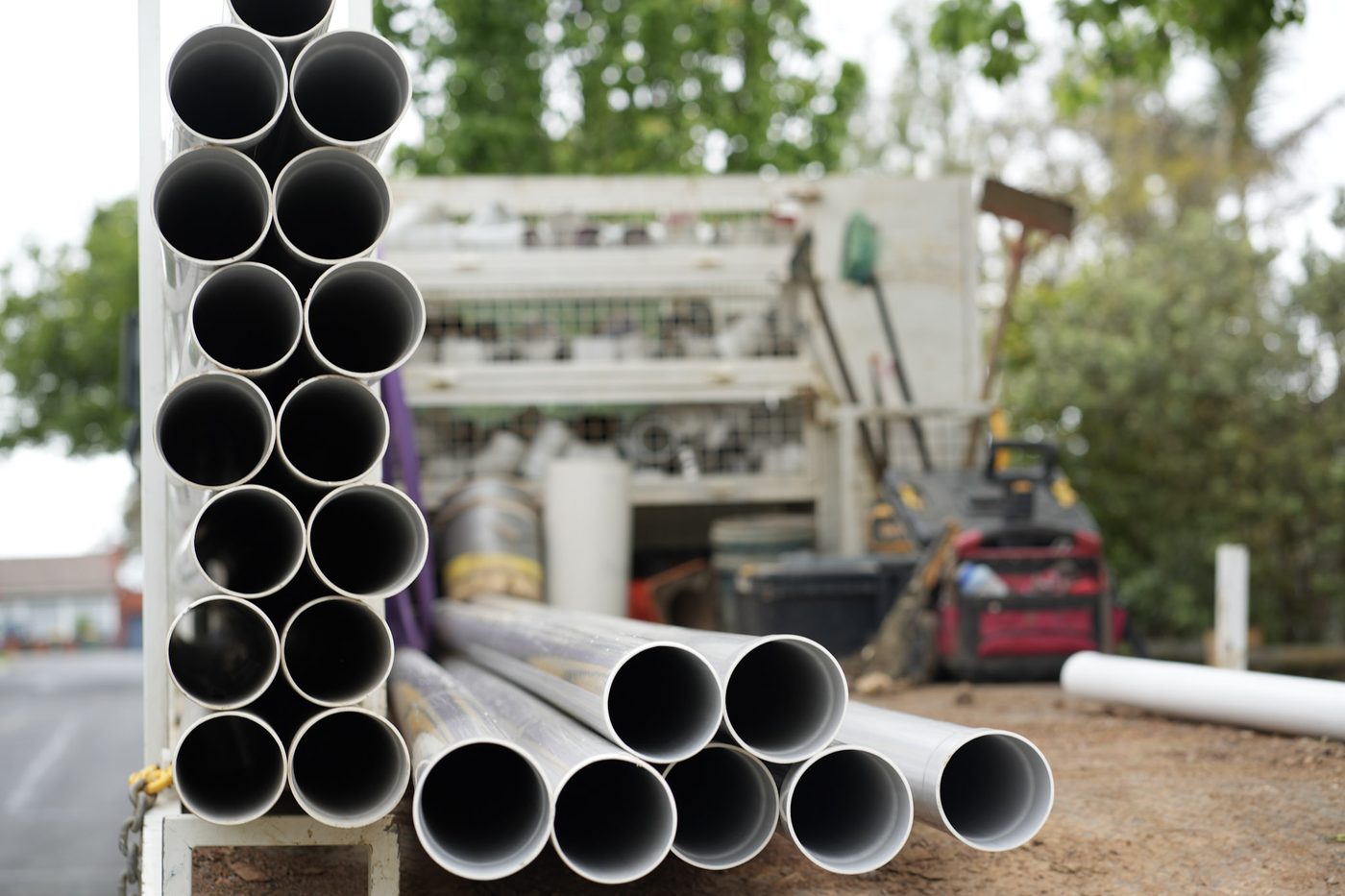 PVC pipes stacked and loaded ready beside the vac truck.